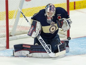 REGINA, SASK : May 18, 2018 -- Host Regina Pats goalie Max Paddock (33) makes a save during a game against the OHL Hamilton Bulldogs in the 100th anniversary of the Memorial Cup at the Brandt Centre in Regina, Saskatchewan. BRANDON HARDER/ Regina Leader-Post