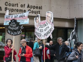 Supporters for the protesters arrested while protesting the Kinder Morgan pipeline project rally outside B.C. Supreme Court in Vancouver ahead of the protesters' court hearing in the city on May 7.