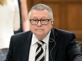 Public Safety and Emergency Preparedness Minister Ralph Goodale appears at a House of Commons committee on May 8, 2018, to testify on Bill C-71. The Canadian Association of Chiefs of Police recently passed a resolution urging the federal government to negotiate an updated sharing agreement with the U.S.