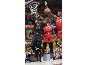 Cleveland Cavaliers' LeBron James (23) goes up to shoot against Toronto Raptors' Serge Ibaka (9), from Republic of Congo, and OG Anunoby (3) in the first half of Game 4 of an NBA basketball second-round playoff series, Monday, May 7, 2018, in Cleveland.