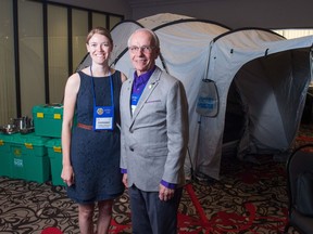 Stephanie Christensen, left, executive director of ShelterBox Canada, and Peter Neufeldt, a district governor for the Rotary Club, stand in front of a ShelterBox demonstration unit at the Delta Hotel on Saskatchewan Drive.