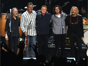 Eagles, Timothy B. Schmit, Vince Gill, Don Henley, Deacon Frey and Joe Walsh perform during the Eagles in Concert at The Grand Ole Opry on October 29, 2017 in Nashville, Tennessee.