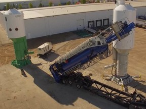 The Saskatoon oil and gas industry services company Quickthree Solutions Inc. has been acquired by Texas-based Smart Sand Inc. for up to US$42.75 million. Pictured is one of the local firm's vertical frac sand storage vessels.
