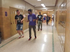 Students at Sheldon-Williams Collegiate in Regina walk in red high heels as part of the school's Walk a Mile in Her Shoes event. The event was organized by the school's Leadership 20/30 class.