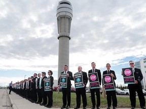 About 150 WestJet pilots protested outside the company's headquarters in Calgary during the WestJet annual general meeting on May 8.