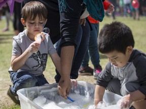 Emerson, age 4, makes bubbles at the SCI-FI Science Camps during the Children's Festival at Kiwanis Park in Saskatoon, SK on Tuesday, June 5, 2018.