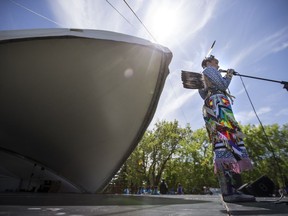 Wanuskewin Heritage Park dancer Randi Candline speaks to students during the Children's Festival at Kiwanis Park in Saskatoon, SK on Tuesday, June 5, 2018. weather sun