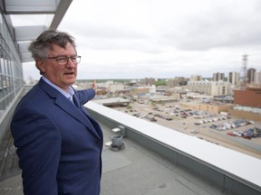 Alan Wallace, the former director of planning and development for the City of Saskatoon, points out a location for a possible new arena in downtown Saskatoon from the upper levels of the Holiday Inn on May 31.