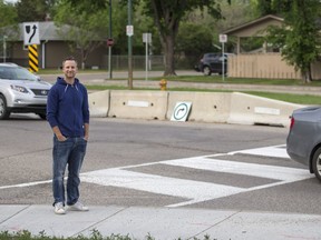 Blayne Hoffman, a resident in the Avalon neighbourhood, stands at the intersection of Glasgow Street and Clarence Avenue in Saskatoon, SK on Thursday, June 7, 2018.