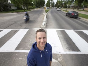 Blayne Hoffman, a resident in the Avalon neighbourhood, stands at the intersection of Glasgow Street and Clarence Avenue in Saskatoon, SK on Thursday, June 7, 2018. A petition appears to show strong support for removing a barrier that prevents left turns from Glasgow onto Clarence, because it has rerouted traffic elsewhere in the Avalon neighbourhood.