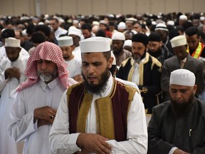 Special guest Imam Jamal (front) led an estimated 10,000 Saskatoon Muslims in prayer during Eid Al Fitr on Friday, June 15. (Matt Olson / Saskatoon StarPhoenix).