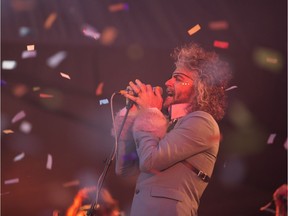 Wayne Coyne from the Flaming Lips plays during their set at the Bessborough Gardens  in Saskatoon, June 22, 2018.