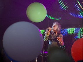 Wayne Coyne from the Flaming Lips plays during their set at the Bessborough Gardens  in Saskatoon on Friday, June 22, 2018.