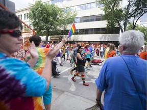 A crowd of marchers walk through the last section of the parade route in celebration of the Saskatoon Pride Parade in Saskatoon, SK on Saturday, June 24, 2017.