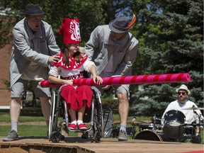 Haley Brown, seated, with Sum Theatre performs a scene from the upcoming Theatre in the Park play, Queen Seraphina and The Land of Vertebraat, during a media event at Raoul Wallenberg Park in Saskatoon, SK on Tuesday, June 26, 2018.
