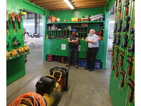 Eugene Wahobin (left) and Kean Mitchell (right) discuss the new Saskatoon Community Industry's tool crib on June 28.