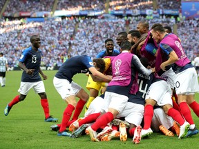 Kylian Mbappe of France celebrates with teammates after scoring his team's third goal during the 2018 FIFA World Cup Russia Round of 16 match between France and Argentina at Kazan Arena on June 30, 2018 in Kazan, Russia.