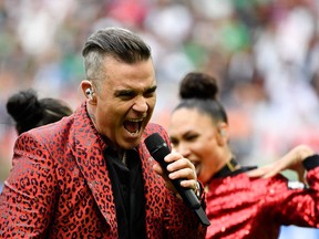 TOPSHOT - English singer Robbie Williams performs during the opening ceremony  before the Russia 2018 World Cup Group A football match between Russia and Saudi Arabia at the Luzhniki Stadium in Moscow on June 14, 2018.