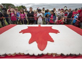 SASKATOON, SASK.; JULY 1, 2016 - 0702 news Canada Day  1000's line up for the Canada Day Cup Cake at the holiday celebration at Deifenbaker Park in Saskatoon put on by the Optimist Club July 1, 2016