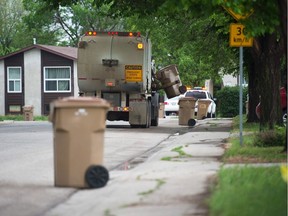 A City of Regina garbage truck collects household waste in the Glencairn neighbourhood.