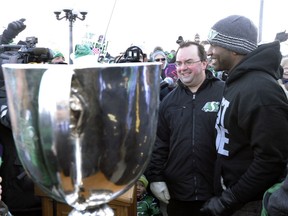Former Saskatchewan Roughriders general manager Brendan Taman knows from personal experience that an elite quarterback is an essential component of a championship team. As an example, Taman is shown with Darian Durant, right, after the Roughriders' 2013 Grey Cup victory.