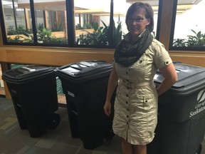 Brenda Wallace, the City of Saskatoon's director of environmental and corporate initiatives, stands next to three different garbage cart sizes at city hall on Wednesday, June 6, 2018. Wallace announced proposals to move to a new model to pay for trash collection through user fees and a city-wide curb-side compost collection program. (PHIL TANK/The StarPhoenix)