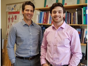 Justin Andrushko (right) and Jonathan Farthing study new ways to maintain strength of injured limbs. (Amanda Davenport for the University of Saskatchewan)