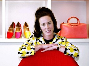 FILE - In this May 13, 2004 file photo, designer Kate Spade poses with handbags and shoes from her next collection in New York. Law enforcement officials say Tuesday, June 5, 2018, that New York fashion designer Kate Spade has been found dead in her apartment in an apparent suicide.