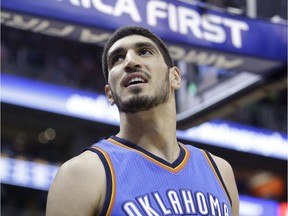 In this March 28, 2015, file photo, Oklahoma City Thunder center Enes Kanter (34) looks on in the second quarter of an NBA basketball game against the Utah Jazz, in Salt Lake City.