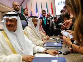 Khalid Al-Falih, Saudi Arabia's energy and industry minister, second left, speaks to reporters at the OPEC meeting in Vienna, Austria, on Friday.