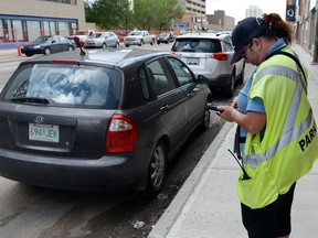 The smartphone app Regina's parking manager has in mind would connect with the handheld device used by parking enforcement officers.