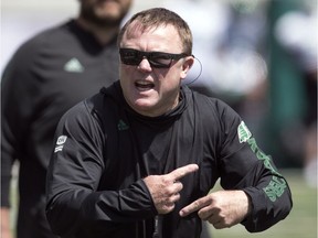 Saskatchewan Roughriders head coach Chris Jones, shown during Tuesday's practice, steadfastly refuses to divulge the identity of his starting quarterback.