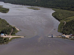 Crews work to clean up an oil spill on the North Saskatchewan river near Maidstone, Sask. on Friday, July 22, 2016.