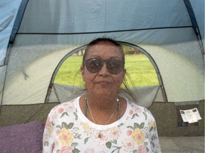 Debbie Baptiste, mother of the late Colten Boushie, sits inside her tent at the "Justice For Our Stolen Children" camp near the Saskatchewan Legislature Building in Regina on Tuesday, June 12, 2018.