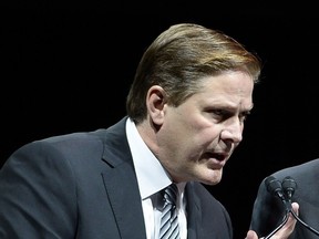 FILE - In this Aug. 24 2017, file photo, Ottawa Senators assistant general manager Randy Lee gestures while speaking at a memorial service for former coach and general manager of the Senators, Bryan Murray, at the Canadian Tire Centre in Ottawa. Senators assistant general manager Randy Lee will miss at least part of next week's NHL draft because he is due in court. He is charged with harassing a hotel shuttle driver in Buffalo. His lawyer told The Associated Press on Tuesday, June 12, 2018, he expects his client to be in court June 22, the day the league holds the first round of its two-day draft in Dallas. (Justin Tang/The Canadian Press via AP, File) ORG XMIT: NY160