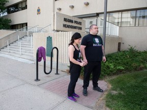 Patrick Warnecke, right, and Megan Potter stand in front of Regina Police Headquarters on Osler Street.