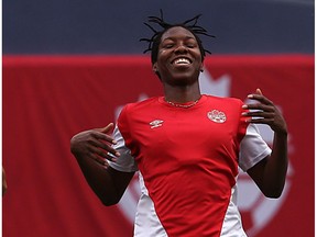 Kadeisha Buchanan of the national women's soccer team laughs as she finishes a foot race at the end of a drill during training at Investors Group Field in Winnipeg on Wed., June 7, 2017.