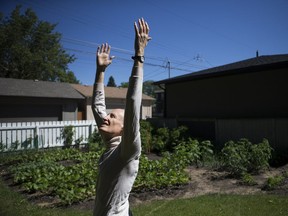 David Edney, a yoga teacher who started programs in the Saskatoon Correctional Centre and a scholarship for Indigenous yoga teachers, shows off some postures at his home in Saskatoon.