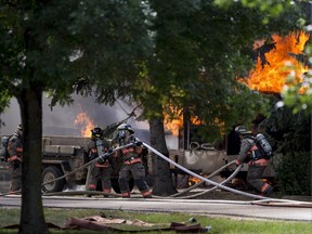 Saskatoon Firefighters respond to a multiple structure fire on Crescent Boulevard in the Montgomery neighbourhood in Saskatoon on Sunday, July 22, 2018.