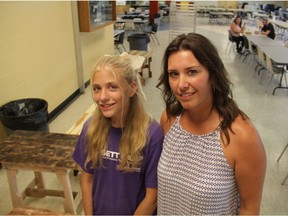 Kietha and Matea Swenson stand in front of several tables constructed from recyclced pallets during Saskatchewan Polytechnic's Girls Exploring Trades and Technology (GETT) camps, on July 13, 2018. Kietha said she felt it was important for her daughter to be introduced to numerous potential career paths as she grows up.