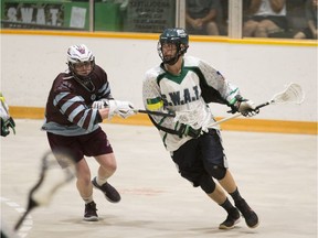 SWAT forward Liam Diebel carries the ball past Calgary Mountaineers transition Adam Yeo during the Rocky Mountain Lacrosse League Semi-Finals at Kinsmen Arena in Saskatoon, SK on Sunday, July 15, 2018.