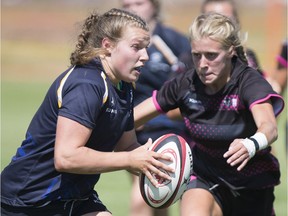 Nova Scotia Keltics loose head Emma Pfleiderer goes to move the ball past a Prairie Wolfpack player during the Canadian Rugby Championships at the Saskatoon Rugby Club in Saskatoon, SK on Monday, July 16, 2018.