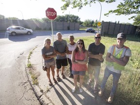 SASKATOON,SK--JULY 17/2018-0718 News Nutana Residents- Nutana residents Sarah Neufeld, left to right, Arnold Neufeld, Vicky Neufeld, Kseniga Smiljic, name withheld, and Nathan Jones stand fro a photograph at the intersection of Ninth Street and Lorne Avenue in Saskatoon, SK on Tuesday, July 17, 2018. The group is upset that the city wants to close the street for a year as an experiment, council will vote on the proposal on Monday.