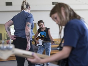 Soleil Oulovsky practises guitar at the loud band practice during a workshop at the second week of Girls Rock Camp, a week-long summer program that teaches young girls collaborative music creation and performance at Mayfair United Church in Saskatoon, SK on Monday, July 23, 2018.