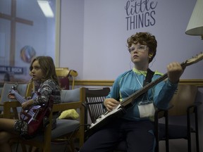 Kara Parker, left, and Syd Burns practise their instruments for the loud band practice during a workshop at the second week of Girls Rock Camp, a week-long summer program that teaches young girls collaborative music creation and performance at Mayfair United Church in Saskatoon, SK on Monday, July 23, 2018.