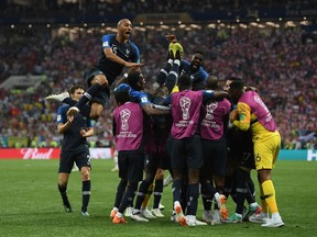 MOSCOW, RUSSIA - JULY 15:  Kylian Mbappe of France celebrates with team mates after scoring during the 2018 FIFA World Cup Russia Final between France and Croatia at Luzhniki Stadium on July 15, 2018 in Moscow, Russia.