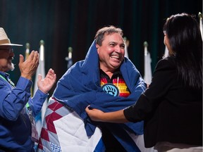 Perry Bellegarde is sworn in after being re-elected as the National Chief of the Assembly of First Nations in Vancouver, B.C., on Wednesday July 25, 2018. He won 328 of the 522 votes in a second ballot, giving him just over the 60 per cent needed to be elected as leader for a second term.