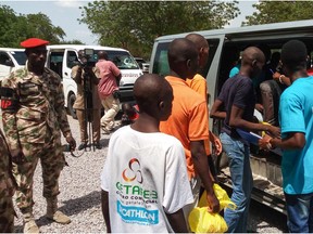 Children, aged between seven and 18, cleared of ties with Boko Haram, get on a car being escorted by military personnel in Maiduguri, on July 9, 2018. The Nigerian army released 183 children on July 9, after clearing them of any ties to Boko Haram, Unicef said in a statement. Boko Haram's nine-year-old fight to establish a hardline Islamic state has claimed at least 20,000 lives and displaced more than two million people.
