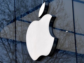 In this file photo taken on February 8, 2018 the logo of the US multinational technology company Apple is on display on the facade of an Apple store in Brussels.