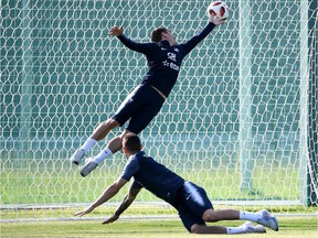 France's forward Antoine Griezmann (R) vies with France's defender Lucas Hernandez during a training session at the Glebovets stadium in Istra, some 70 km west of Moscow on July 12, 2018, ahead of their Russia 2018 World Cup final football match against Croatia.